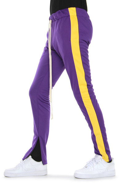 purple and yellow track pants