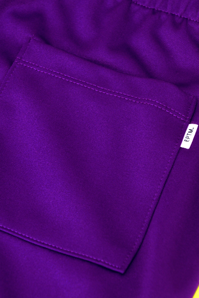 purple and yellow track pants